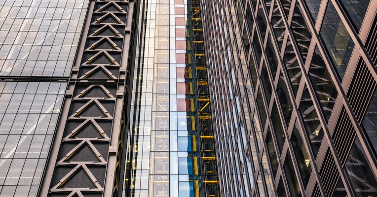 Fixed-fee AI security assessment: the braced diagonal frame of a City of London office tower seen close up